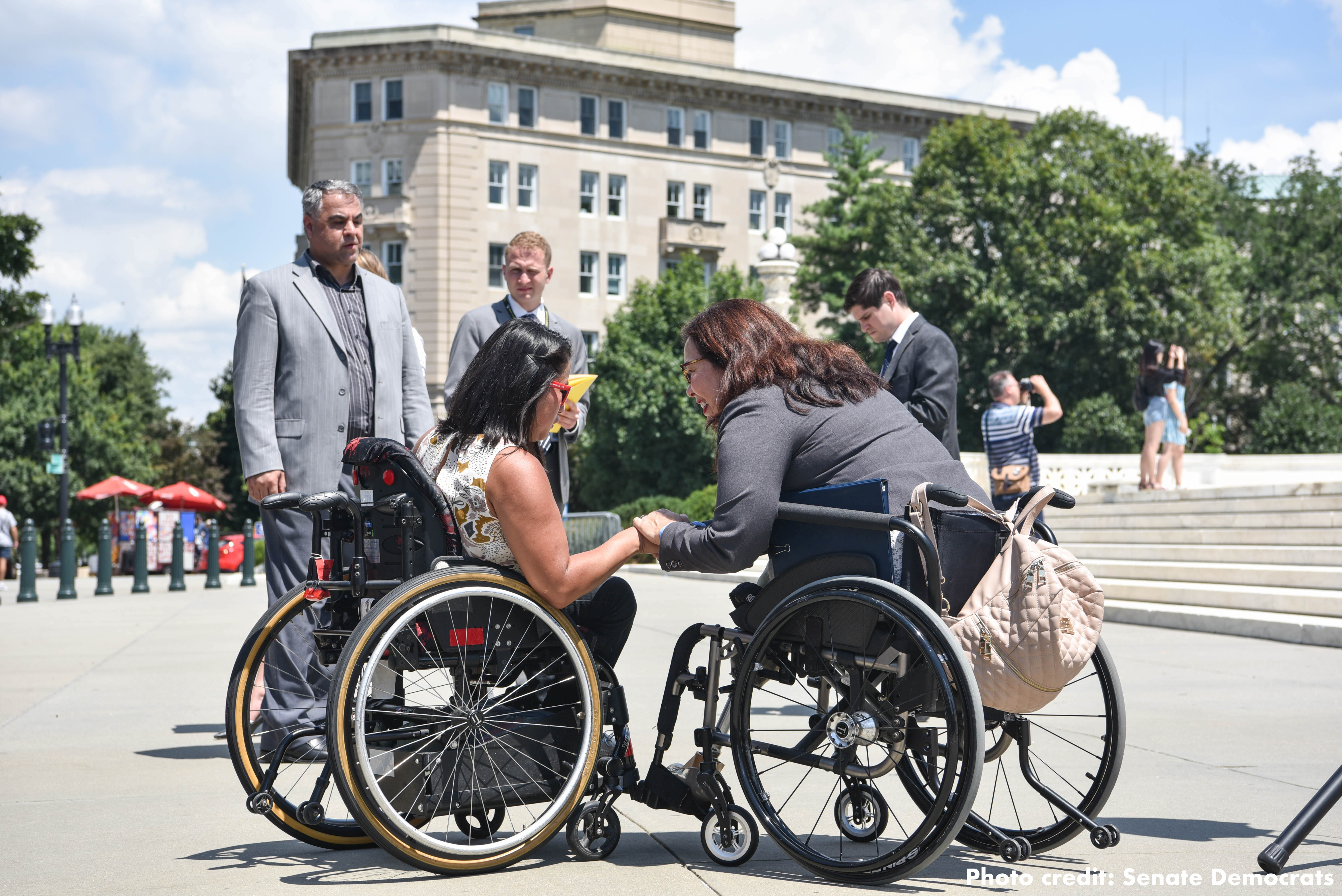 Wheelchair-using Senator Tammy Duckworth meets with activists.